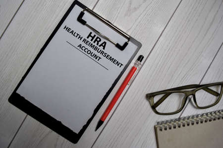 HRA - Health Reimbursement Account write on a paperwork isolated on office desk.の写真素材