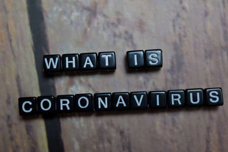 CLose up text What is Coronavirus on wooden blockの写真素材