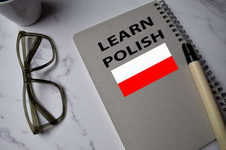 Learn Polish write on a book isolated on Office Deskの写真素材