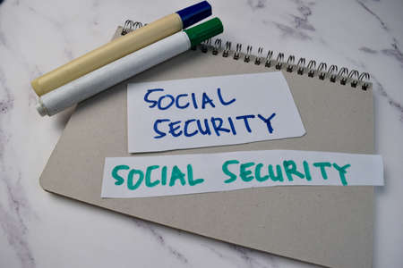 Social Security write on a book isolated on Office Desk.