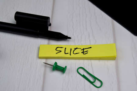 Slice write on sticky notes isolated on office deskの写真素材