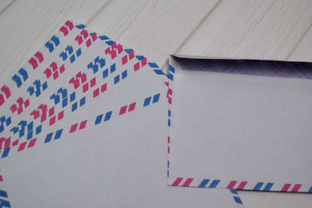 Air Mail Envelope isolated on wooden table.