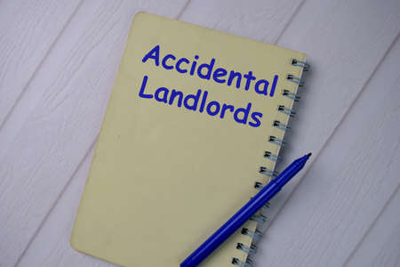 Book about FSBO Noticed isolated on wooden table.