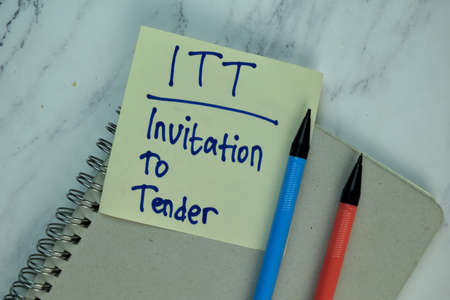 Inspection write on sticky note isolated on Wooden Table. Supported by additional service. Business...