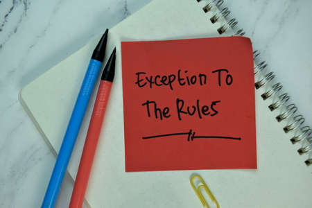Inspection write on sticky note isolated on Wooden Table. Supported by additional service. Business...