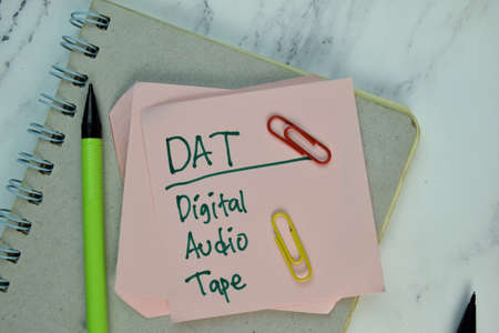 Inspection write on sticky note isolated on Wooden Table. Supported by additional service. Business...