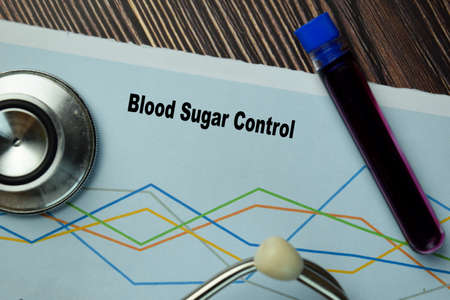 Change into Change on wooden block isolated on wooden tableの写真素材