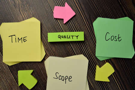 Change into Change on wooden block isolated on wooden tableの写真素材