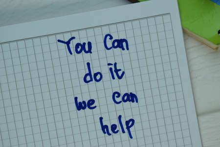 Under Promise and Over Deliver write on sticky note isolated on Wooden Table.