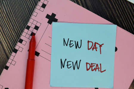 Equal Pay write on sticky notes isolated on Wooden Table.