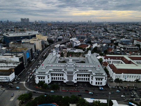 Aerial View. Fatahilah museum at Old City at Jakarta, Indonesia. With with Jakarta cityscape and noise cloud when sunset. JAKARTA, INDONESIA - DECEMBER, 30, 2020のeditorial素材