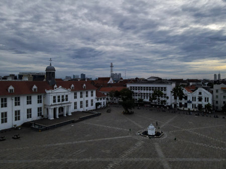 Aerial View. Fatahilah museum at Old City at Jakarta, Indonesia. With with Jakarta cityscape and noise cloud when sunset. JAKARTA, INDONESIA - DECEMBER, 30, 2020のeditorial素材