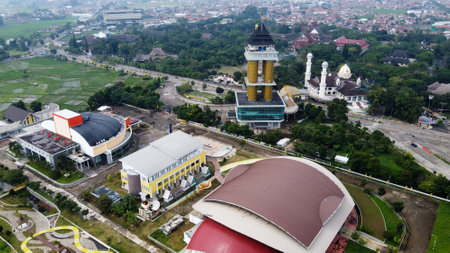 Aerial view of football stadium in Bandung City, Indonesia. Sunset/sunrise and noise cloud. Drone shot. Bandung, Indonesia - 04 22 2021のeditorial素材