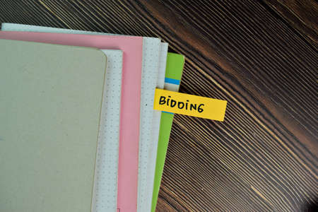 It's Time to Minimize Risk write on sticky notes isolated on Wooden Table.の写真素材