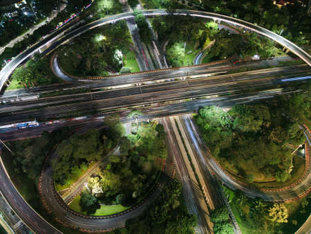 Spectacular nighttime skyline of a big modern city at night. Semanggi, Jakarta, Indonesia. Aerial...