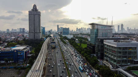 Pakubuwono skyline aerial drone view from above, Jakarta downtown skyscrapers cityscape and noise cloud with Jakarta cityscape. JAKARTA - Indonesia. February 23, 2021のeditorial素材