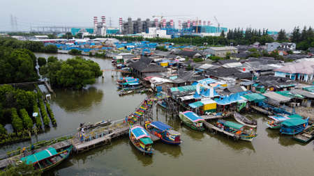 Aerial view of fisherman village and mangrove forest in rainy season. Bekasi, Indonesia, March 9, 2021のeditorial素材