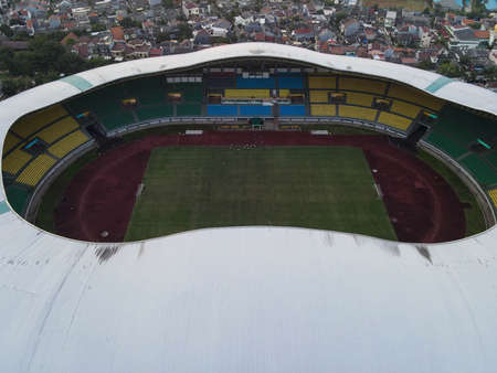 Aerial View of The largest stadium of Bekasi from drone when sunset and noise cloud. Bekasi, Indonesia, March 21, 2021のeditorial素材