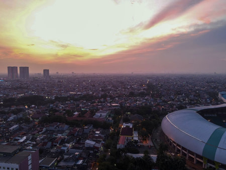 Aerial View of The largest stadium of Bekasi from drone when sunset and noise cloud. Bekasi,...