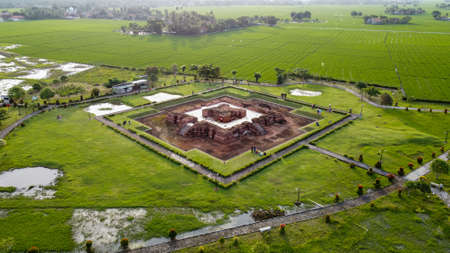 Aerial drone view of A long bridge to the end of the river connects the two villages at Bekasi with noise cloud. Bekasi, Indonesia. March 21, 2021のeditorial素材