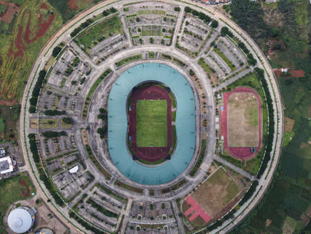LRT , Monorail movement on track moving fast taken at station Cibubur. with background of traffic ,mountain and sky. Jakarta, Indonesia - March, 25, 2021のeditorial素材