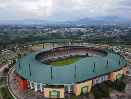 LRT , Monorail movement on track moving fast taken at station Cibubur. with background of traffic ,mountain and sky. Jakarta, Indonesia - March, 25, 2021のeditorial素材