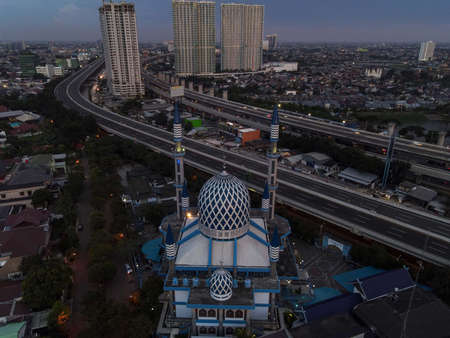 Al-azhar Center Mosque panorama view Largest Mosque in Bekasi. Ramadan and Eid Concept and noise cloud when sunset or sunrise view. Bekasi, Indonesia, April 8, 2021のeditorial素材