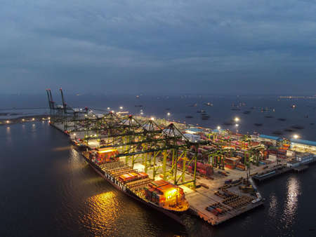 Aerial view of Container ship loading and unloading in deep sea port, logistic import and export...