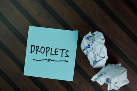 Inflammatory Breast Cancer write on sticky notes isolated on Wooden Table.の写真素材