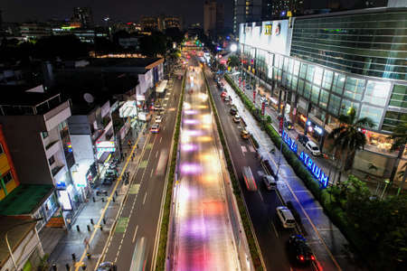 Aerial view of the city traffics at the Hotel Indonesia Roundabout. Vehicles are moving on the road between buildings. Jakarta, Indonesia, April 28, 2021のeditorial素材
