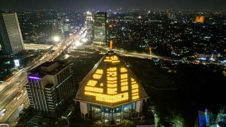Aerial view of the largest Mosque in Jakarta. Ramadan and Eid Concept and noise cloud when at night view. Jakarta, Indonesia, May 4, 2021のeditorial素材