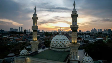 Aerial view of the largest Mosque in Jakarta. Ramadan and Eid Concept and noise cloud when at night view. Jakarta, Indonesia, May 4, 2021のeditorial素材