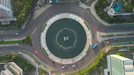 Aerial view of highway intersection and buildings in the city of Jakarta and noise cloud with Jakarta cityscape. Jakarta, Indonesia, May 13, 2021のeditorial素材