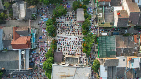 Aerial View of People offering prayers on the Eid morning at famous mosque Jama Masjid in Bekasi. Bekasi, Indonesia, May 16, 2021のeditorial素材