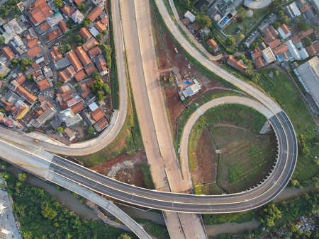 Aerial view on the new road construction site. Bekasi, Indonesia, May 31, 2021のeditorial素材