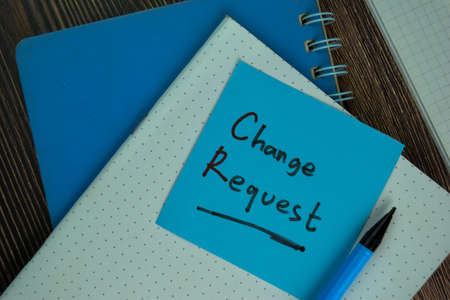 Change Request write on sticky notes isolated on Wooden Table.の写真素材
