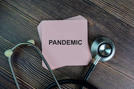 Surveillance Audit write on sticky notes isolated on Wooden Table.の写真素材