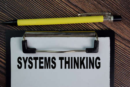 Price Vs Cost write on sticky notes isolated on Wooden Table.の写真素材