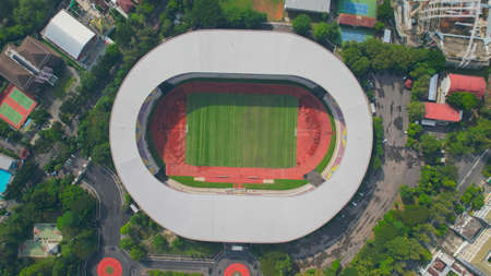 Aerial top down view of the Beautiful scenery of Manahan Solo Stadium. with cityscape background. Solo, Indonesia, July 1, 2021のeditorial素材