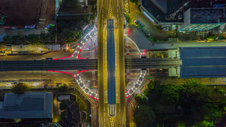 Aerial view of articulated city buses arriving and leaving at bus station near main railway station...