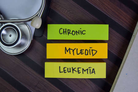 Uterine Fibroid write on sticky notes isolated on Wooden Table.の写真素材