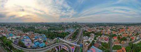 Aerial view of infinity sign traffic junction cross 'Jakarta a city of collaboartion' road with car transport. Jakarta, September 2, 2021のeditorial素材