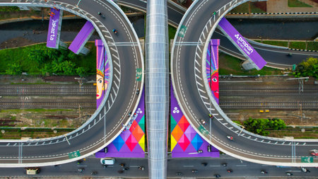 Aerial view of infinity sign traffic junction cross 'Jakarta a city of collaboartion' road with car transport. Jakarta, September 2, 2021のeditorial素材