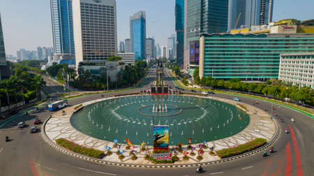 Aerial view of West Irian Liberation monument in downtown Jakarta with Jakarta cityscape. Jakarta, Indonesia, September 5, 2021のeditorial素材
