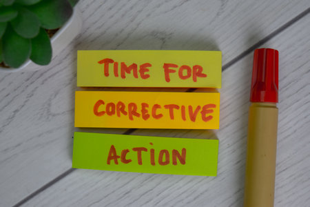 VSM - Value Stream Mapping write on sticky notes isolated on Wooden Table.