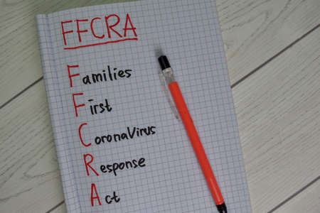 VSM - Value Stream Mapping write on sticky notes isolated on Wooden Table.の写真素材