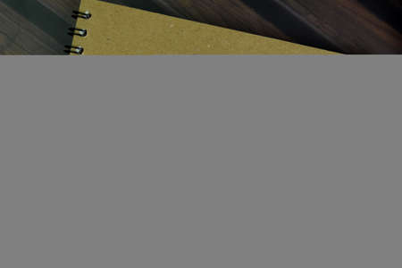 BMI - Weight and Height write on a book isolated on Wooden Table.の写真素材