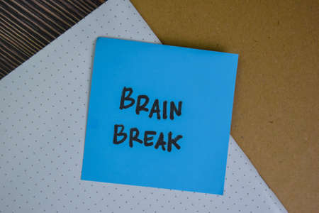 Brain Break write on sticky notes isolated on Wooden Table.