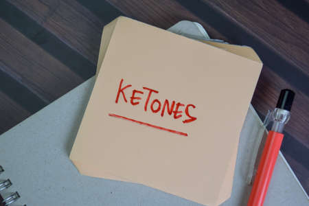 Stock and Buyback write on sticky notes isolated on Wooden Table.