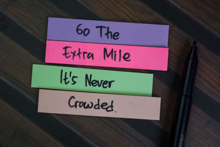 Stock and Buyback write on sticky notes isolated on Wooden Table.の写真素材